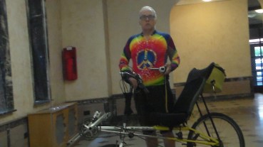 This is me in my semi-formal bike shirt standing with my 10,000 mile bike