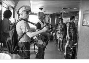 me onboard the ferry to Staten Island trying to tune a low E. Picture courtesy of Resa Sunshine.